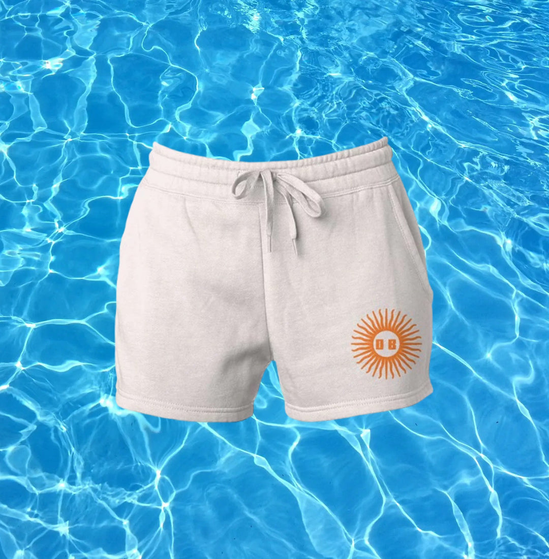 cotton sun shorts in neutral tan with orange design
