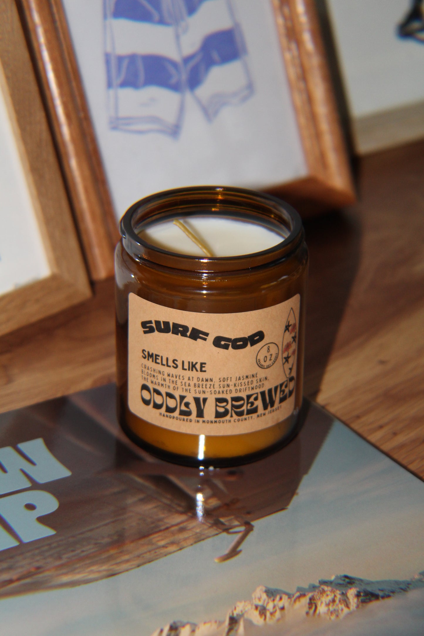 Candle in a glass jar with a label on a wooden surface